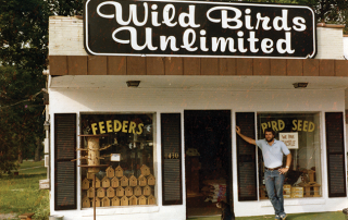 35 year old picture of Jim Carpenter in front of his first store